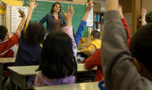 Raised hands in the classroom