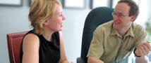 Teacher and GSO staff in meeting